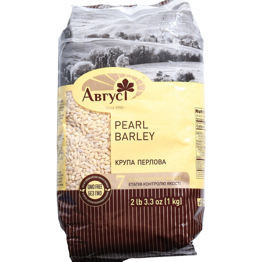 Avgust Pearl Barley No. 1, 35.27 oz (1 kg) — premium pearl barley groats made from polished barley grains, ideal for soups, stews, side dishes, and traditional Eastern European recipes. Packaged in a clear-window bag showing the barley grains with Avgust branding.
