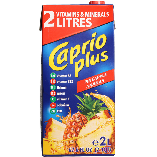 Caprio Plus Pineapple Drink, 67.6 fl oz (2 L) — pineapple-flavored fruit drink carton with vitamins and minerals, featuring pineapple imagery on the front.
