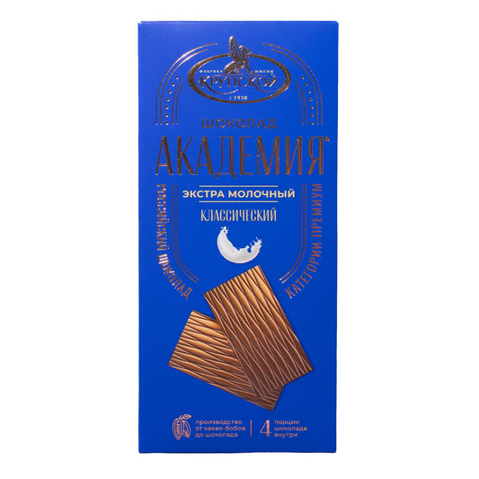 Krupskaya Akademiya extra milk classic milk chocolate bar, 3.1 oz, front packaging in blue with chocolate pieces shown