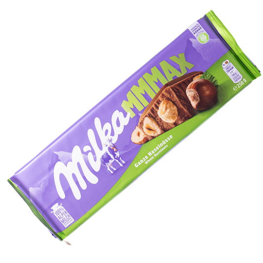 Milka MMMAX whole hazelnuts alpine milk chocolate bar, 8.81 oz, purple and green wrapper on a white background.