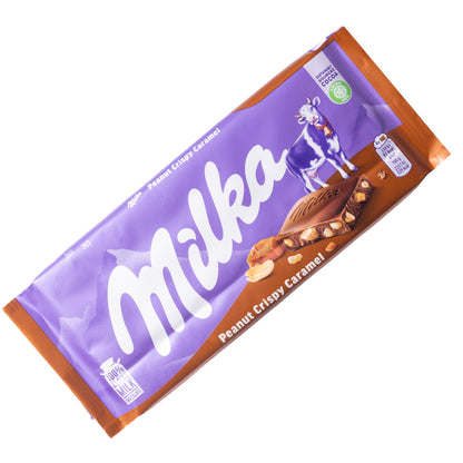 Milka Peanut Crispy Caramel milk chocolate bar, 3.17 oz — purple and brown wrapper on white background.