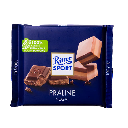 Ritter Sport Praline Nugat milk chocolate bar, 3.5 oz, blue wrapper with “Praline Nugat” text and chocolate piece graphic on a white background.