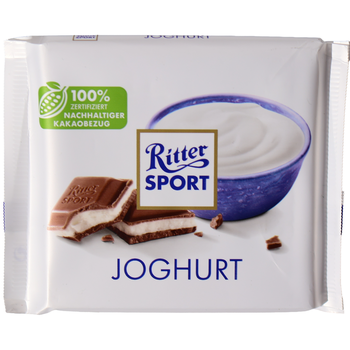 Ritter Sport Joghurt milk chocolate bar in a white wrapper with yogurt and filled chocolate illustrations.