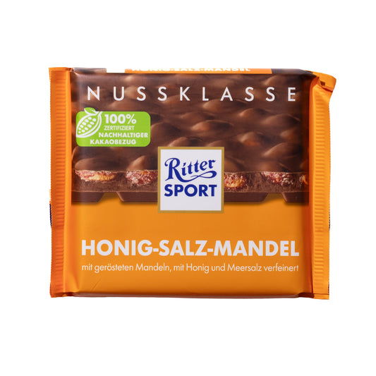 Ritter Sport Honey Sea-Salt Almonds milk chocolate bar, 3.5 oz — orange “Honig-Salz-Mandel” wrapper with chocolate-and-almond image on a white background.