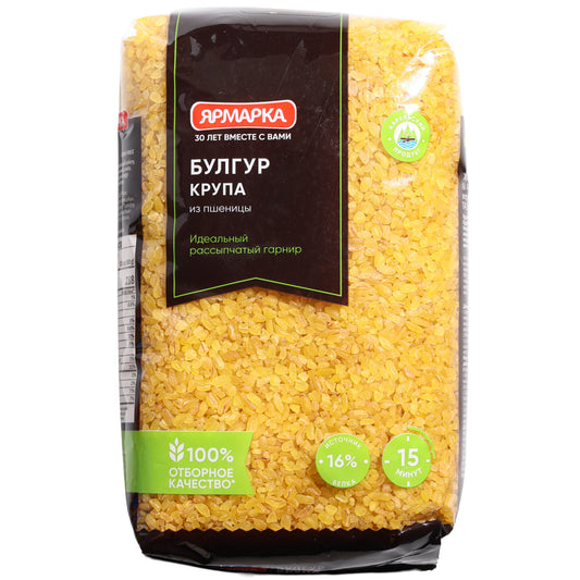 Yarmarka Bulgur Wheat Groats, 24.7 oz (700 g) — bulgur made from cracked and pre-cooked wheat, offering a hearty texture and nutty flavor. Ideal for pilafs, salads, side dishes, soups, stuffing, and traditional Middle Eastern and Mediterranean recipes. Quick-cooking and versatile, packaged in a clear bag showcasing the grains with Yarmarka branding.
